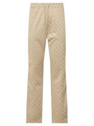 Guess Spodnie dresowe Z5BB07 K2042 Beżowy Regular Fit. Brązowe spodnie dresowe męskie Guess, z aplikacjami, z dresówki. Za 524.99 zł.