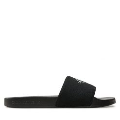 Klapki Calvin Klein Jeans. Czarne klapki damskie Calvin Klein Jeans, bez wzorów, z jeansu, bez obcasa. Za 109.99 zł.