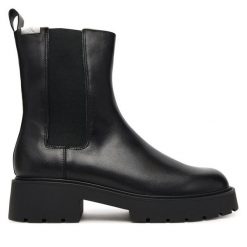 Sztyblety Calvin Klein Jeans. Czarne botki damskie Calvin Klein Jeans, z jeansu, bez obcasa, na płaskiej podeszwie, bez zapięcia. Za 639.99 zł.