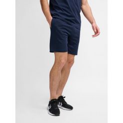 Krótka Hummel Active CO. Niebieskie szorty sportowe męskie HUMMEL, na fitness i siłownię. Za 179.50 zł.