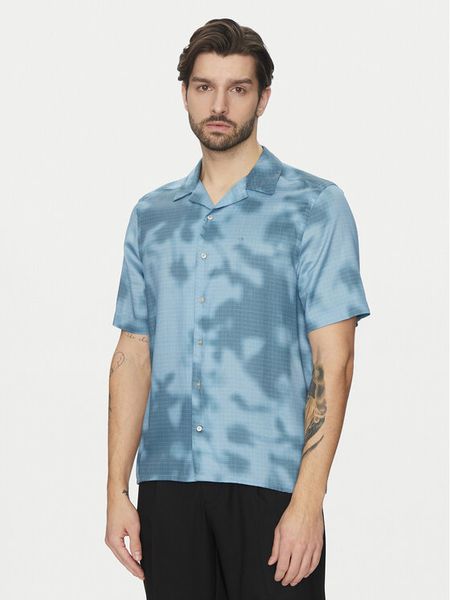 Calvin Klein Koszula K10K114190 Niebieski Regular Fit. Niebieskie koszule męskie CALVIN KLEIN, l, bez wzorów, z lyocellu, bez kołnierzyka, bez ramiączek. Za 219.99 zł.