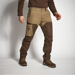 Spodnie outdoor Solognac Renfort 520. Brązowe spodnie materiałowe męskie SOLOGNAC, bez wzorów, z bawełny, sportowe. Za 159.99 zł.