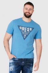 GUESS Niebieski t-shirt męski z dużym logo. Niebieskie t-shirty męskie Guess, m, z aplikacjami, bez kołnierzyka. W wyprzedaży za 109.99 zł.