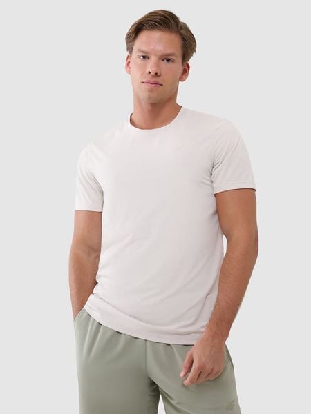 4F Koszulka sportowa w kolorze kremowym rozmiar: M. Brązowe t-shirty sportowe męskie 4f, m, z materiału, bez ramiączek, na fitness i siłownię. Za 68.95 zł.