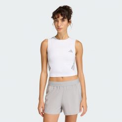 Koszulka adi365 Iconic Running Crop Tank. Białe bluzki sportowe damskie Adidas, bez wzorów, bez kołnierzyka. Za 129.00 zł.