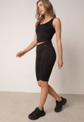 Czarne Szorty Kolarki z Wysokim Stanem i Modelującym Pasem Toadgrass. Czarne szorty damskie Born2be, bez wzorów, eleganckie, z podwyższonym stanem. Za 39.99 zł.