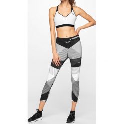 Legginsy do biegania damskie SPDF102 - multikolor 1 allover. Legginsy damskie 4f, bez wzorów, z dzianiny. W wyprzedaży za 99.99 zł.