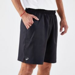 Spodenki do tenisa męskie Kuikma Essential+. Niebieskie szorty męskie ARTENGO, bez wzorów, z materiału, sportowe. W wyprzedaży za 39.99 zł.