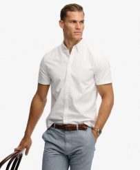 Superdry Koszula Preppy Oxford krótki rękaw z bawełny organicznej – OPTIC. Białe koszule damskie Superdry., m, bez wzorów, z bawełny, bez kołnierzyka, bez ramiączek. Za 254.60 zł.