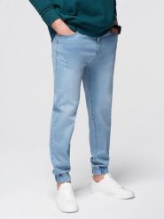 Męskie spodnie jeansowe JOGGERY z klasyczna opaśnicą - jasnoniebieskie V1 - Rozmiar: M. Niebieskie spodnie materiałowe męskie Ombre Clothing, bez wzorów, z bawełny, klasyczne. W wyprzedaży za 179.99 zł.