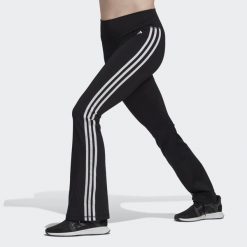Legginsy treningowe damskie adidas Training Essentials Flared Tights. Czarne legginsy damskie Adidas, xs, bez wzorów, z materiału, na fitness i siłownię. Za 222.00 zł.