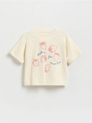 T-shirt z nadrukiem - kremowy. Białe koszulki dziewczęce Reserved, bez wzorów, z bawełny, bez ramiączek. W wyprzedaży za 17.99 zł.