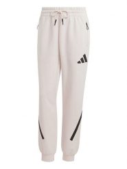 Adidas Spodnie dresowe "Z.N.E." w kolorze kremowym rozmiar: L. Brązowe spodnie dresowe damskie Adidas, l, bez wzorów, z dresówki. Za 160.96 zł.