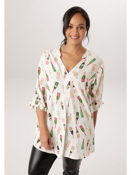 Aniston Bluzka w kolorze kremowym ze wzorem rozmiar: 46. Brązowe bluzki damskie Aniston, bez wzorów, z wiskozy, bez kołnierzyka, bez ramiączek. Za 127.35 zł.