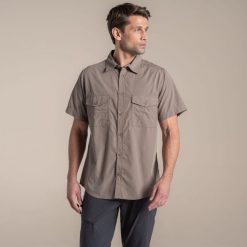 Koszula Craghoppers Kiwi II. Brązowe koszule męskie CRAGHOPPERS, m, bez wzorów, bez kołnierzyka, bez ramiączek. W wyprzedaży za 207.35 zł.