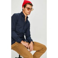 Tommy Hilfiger Tailored - Koszula. Białe koszule męskie Tommy Hilfiger Tailored, m, bez wzorów, z bawełny, bez kołnierzyka, bez ramiączek. W wyprzedaży za 339.90 zł.
