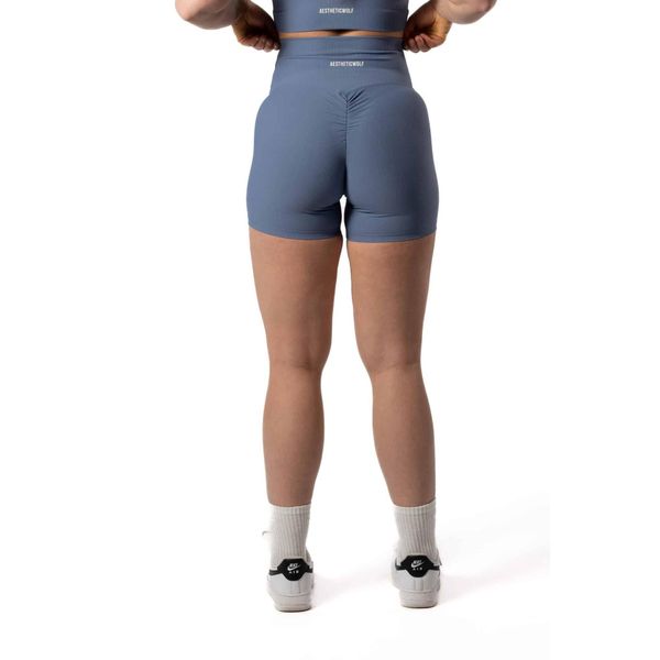 Damskie szorty bezszwowe prążkowane z efektem scrunch – błękitny. Niebieskie spodenki sportowe damskie AESTHETIC WOLF, xs, z dzianiny, na fitness i siłownię. Za 99.99 zł.