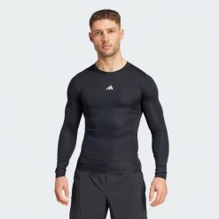 Koszulka TECHFIT Compression Training Long Sleeve. Czarne t-shirty sportowe męskie Adidas, m, z materiału, bez ramiączek, na fitness i siłownię, techfit (adidas). Za 179.00 zł.
