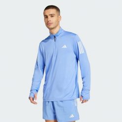 Bluza Own The Run Half-Zip. Niebieskie bluzy bez kaptura męskie Adidas, l. Za 205.70 zł.