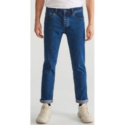 Spodnie jeansowe slim - Granatowy. Niebieskie spodnie materiałowe męskie Reserved, bez wzorów, z jeansu. Za 149.99 zł.