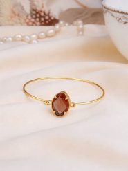 Pierres de Jade Pozłacana bransoletka z cyrkonią rozmiar: onesize. Brązowe bransoletki damskie Pierres de Jade, pozłacane. Za 42.47 zł.