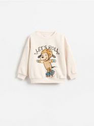 Bluza oversize z nadrukiem - kremowy. Białe bluzy i bluzki niemowlęce Reserved, bez wzorów, z bawełny, bez ramiączek, bez kaptura. Za 49.99 zł.