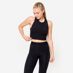 Koszulka fitness damska Domyos crop top bez rękawów. Czarne bluzki sportowe damskie DOMYOS, l, bez wzorów, z elastanu, bez ramiączek. W wyprzedaży za 49.99 zł.
