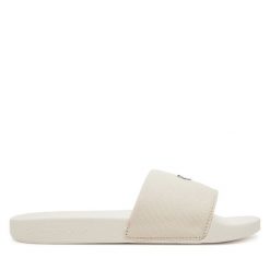 Klapki Calvin Klein Jeans. Klapki damskie Calvin Klein Jeans, bez wzorów, z jeansu, bez obcasa. Za 139.99 zł.