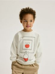Bawełniana bluza Miffy - złamana biel. Bluzy i bluzki niemowlęce Reserved, bez wzorów, z bawełny, bez ramiączek, bez kaptura. W wyprzedaży za 25.99 zł.