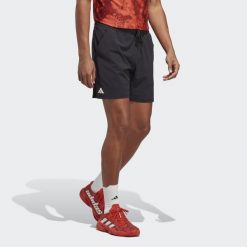 Spodenki do tenisa męskie Adidas Ergo Tennis Shorts. Czarne szorty męskie Adidas, bez wzorów, z elastanu, klasyczne. Za 271.30 zł.