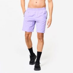 Spodenki fitness cardio męskie Domyos. Fioletowe szorty sportowe męskie DOMYOS, m, z elastanu, na fitness i siłownię. Za 49.99 zł.