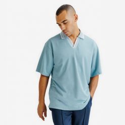 Koszulka polo oversize męska Heritage. Niebieskie koszulki polo męskie Decathlon, l, bez wzorów, z materiału, bez ramiączek. Za 89.99 zł.