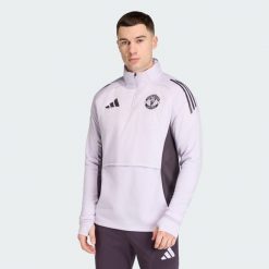 Koszulka Manchester United Tiro 25 Competition Winterized. Czarne t-shirty sportowe męskie Adidas, xs, z dresówki, bez ramiączek, do piłki nożnej. Za 369.00 zł.