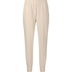 Damskie spodnie dresowe Athlecia Hecey. Białe spodnie dresowe damskie Athlecia, bez wzorów, z dresówki. Za 195.00 zł.