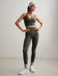 Damskie legginsy bezszwowe, wysoki stan, squat proof petite Shape zielony ivy. Zielone legginsy sportowe damskie Aim'n, xl, bez wzorów, z elastanu, z podwyższonym stanem, na fitness i siłownię. Za 301.00 zł.