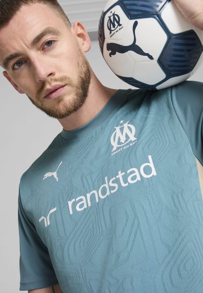 Męska koszulka treningowa Olympique Marsylia PUMA Bold Blue Putty Beige. Brązowe t-shirty sportowe męskie Puma, m, z żakardem, bez ramiączek, do piłki nożnej. Za 234.65 zł.