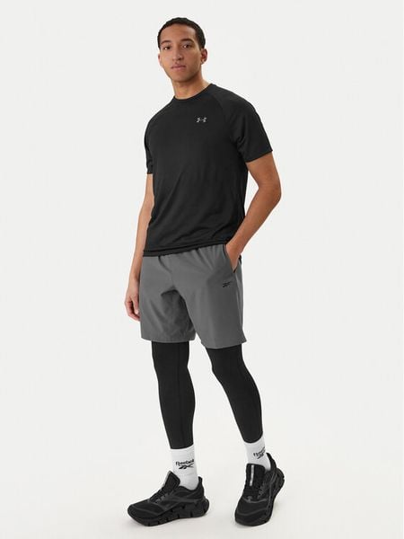 Reebok Legginsy RK25601CCM Czarny Slim Fit. Czarne spodnie sportowe męskie Reebok, z syntetyku. Za 89.99 zł.