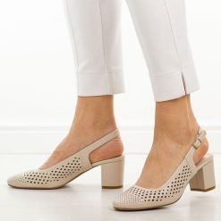 Cieliste ażurowe czółenka damskie na słupku Sergio Leone Sk854. Czółenka damskie Sergio Leone, w ażurowe wzory, ze skóry, z okrągłym noskiem, bez obcasa, na słupku. Za 169.00 zł.