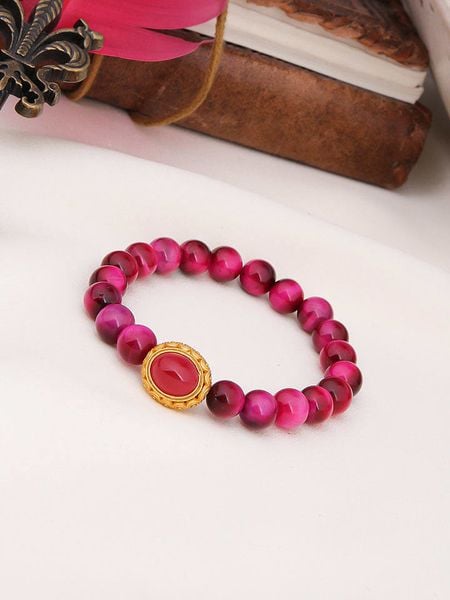 Pierres de Jade Pozłacana bransoletka z tygrysim okiem rozmiar: onesize. Różowe bransoletki damskie Pierres de Jade, pozłacane. Za 43.99 zł.