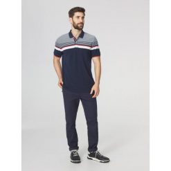 Koszulka polo męska TBS Eltonpol. Niebieskie koszulki polo męskie Tbs, m, bez ramiączek, żeglarskie. Za 329.00 zł.