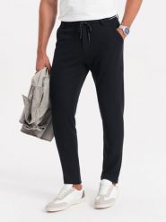 Dzianinowe spodnie męskie z gumką w pasie - czarne V4 OM-PACP-0116 - L. Czarne spodnie materiałowe męskie Ombre Clothing, bez wzorów, z dzianiny. W wyprzedaży za 149.99 zł.