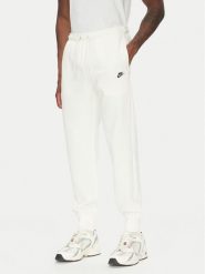 Nike Spodnie dresowe FN3801 Écru Regular Fit. Spodnie dresowe męskie Nike, bez wzorów, z bawełny. Za 239.99 zł.