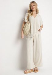 Ciemnobeżowy Komplet z Bawełny T-shirt Oversize i Szerokie Spodnie Lavtebia. Brązowe spodnie materiałowe damskie Born2be, bez wzorów, z bawełny, eleganckie. Za 79.99 zł.