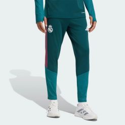 Spodnie treningowe Real Madryt 26/27 Tiro26 Competition. Czerwone spodnie materiałowe męskie Adidas, bez wzorów, z materiału, klasyczne, z standardowym stanem. Za 279.00 zł.