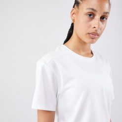 Koszulka tenisowa krótki rękaw damska Artengo Crop Top DRY. Białe bluzki damskie ARTENGO, xl, bez wzorów, z elastanu, sportowe, bez kołnierzyka, bez ramiączek. W wyprzedaży za 69.99 zł.