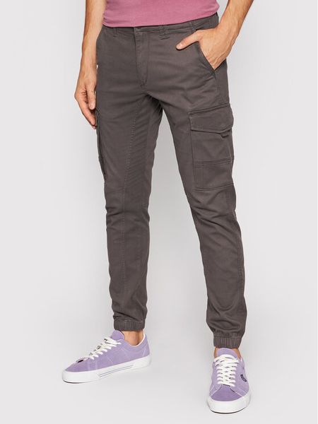Jack & Jones Spodnie materiałowe Paul 12140326 Szary Tapered Fit. Szare spodnie materiałowe męskie Jack & Jones, bez wzorów, z bawełny. Za 149.99 zł.