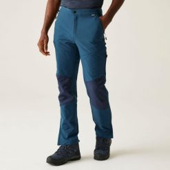 Questra V Męskie spacerowe spodnie turystyczne. Niebieskie spodnie materiałowe męskie Regatta, bez wzorów, sportowe. Za 249.99 zł.