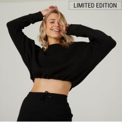Bluza damska Domyos Gym & Pilates crop. Czarne bluzy bez kaptura damskie DOMYOS, s, bez wzorów, z bawełny, bez ramiączek, krótkie, bez kaptura. W wyprzedaży za 59.99 zł.
