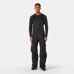Spodnie narciarskie z szelkami Helly Hansen Elevation Infin Shell. Czarne spodnie materiałowe męskie Helly Hansen, bez wzorów, sportowe. W wyprzedaży za 2,573.50 zł.