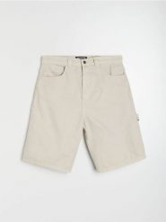 Bawełniane szorty baggy - kremowy. Białe szorty męskie Sinsay, bez wzorów, z bawełny. Za 69.99 zł.